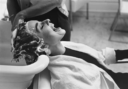 Published in LIFE in 1953, Mark Shaw's photo of Audrey Hepburn shows her being shampooed on the set of Sabrina.