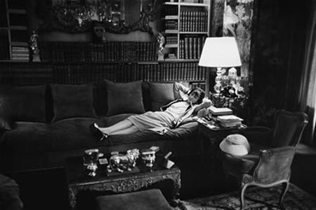 Published in LIFE in 1957: Coco Chanel, aged 74, at her apartment on the Rue Cambon in Paris reclining on her massive divan.