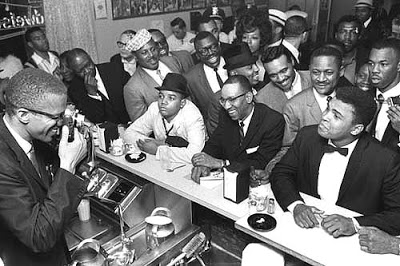 Image #1 for LIBRARY OF CONGRESS AQUIRES BOB GOMEL'S ICONIC PHOTOGRAPH OF MALCOLM X AND CASSIUS CLAY