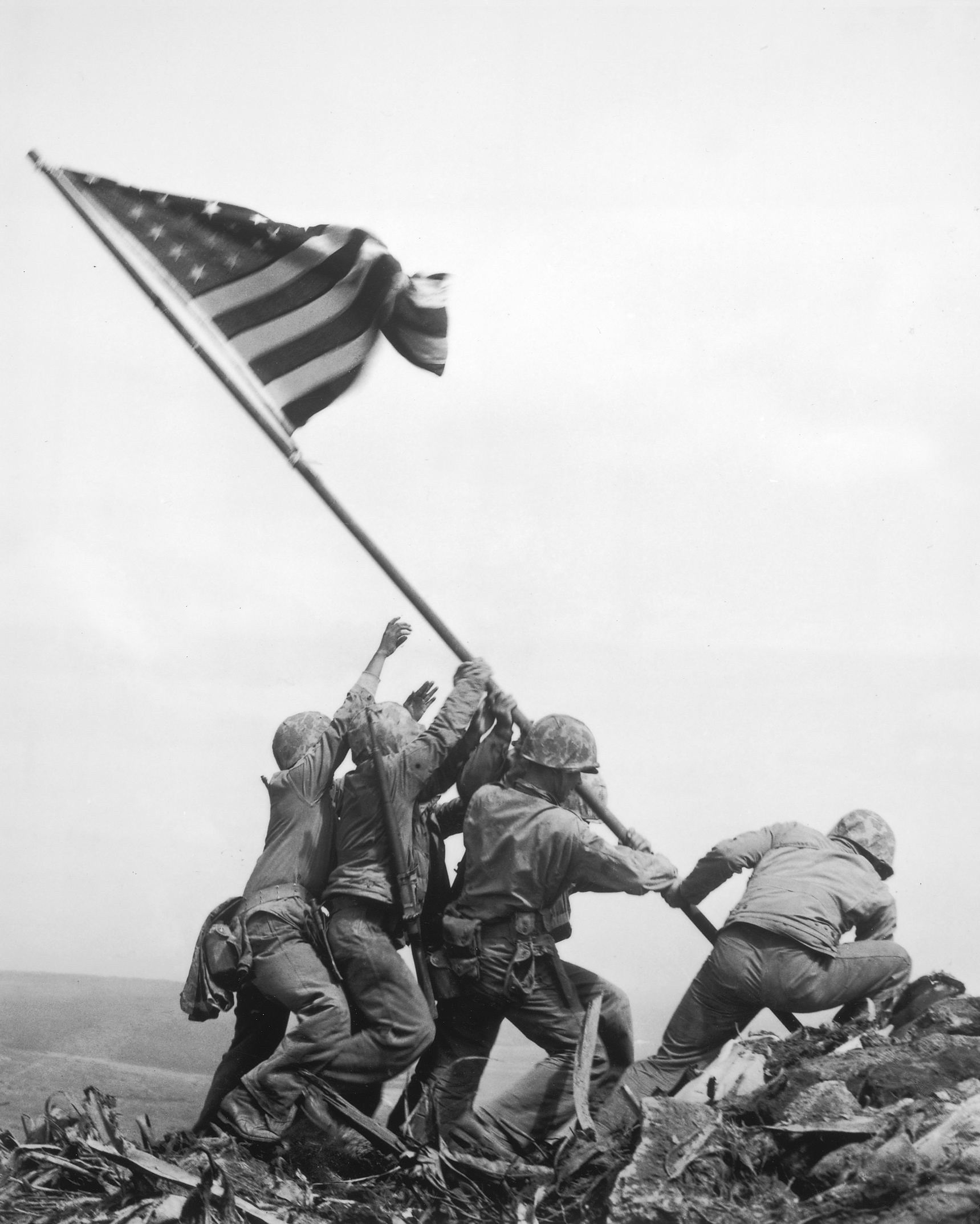 famous photograph of six U.S. Marines raising the American flag on Mount Suribachi on Iwo Jima in February, 1945