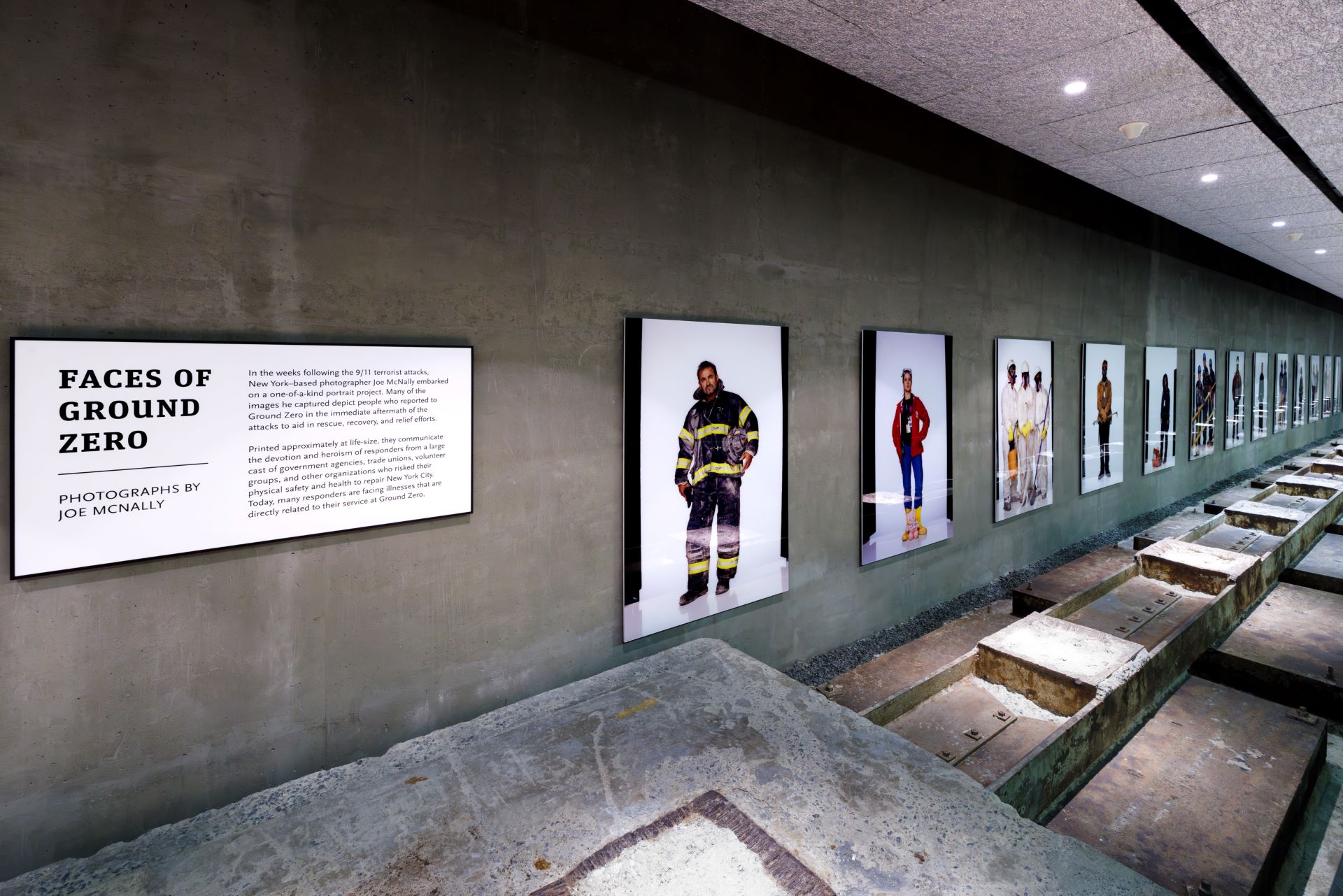 Photograph showing installation view of Joe McNally'sFaces of Ground Zero Gian Polaroids ate the 9/11 museum
