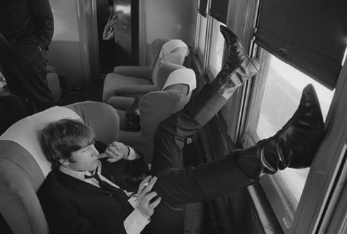 John Lennon. Train to D.C. Feb 10, 1964.  Copyright Bill Eppridge