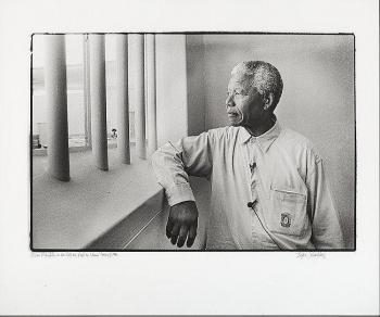 Nelson Mandela in his former cell on Robben Island